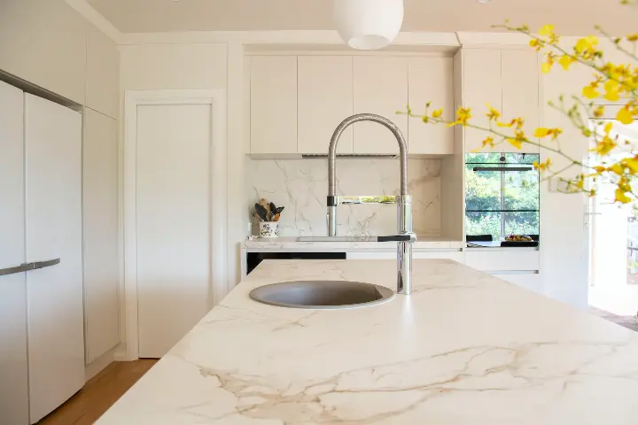 Kitchen Quartz counter with stainless steel faucet on sink