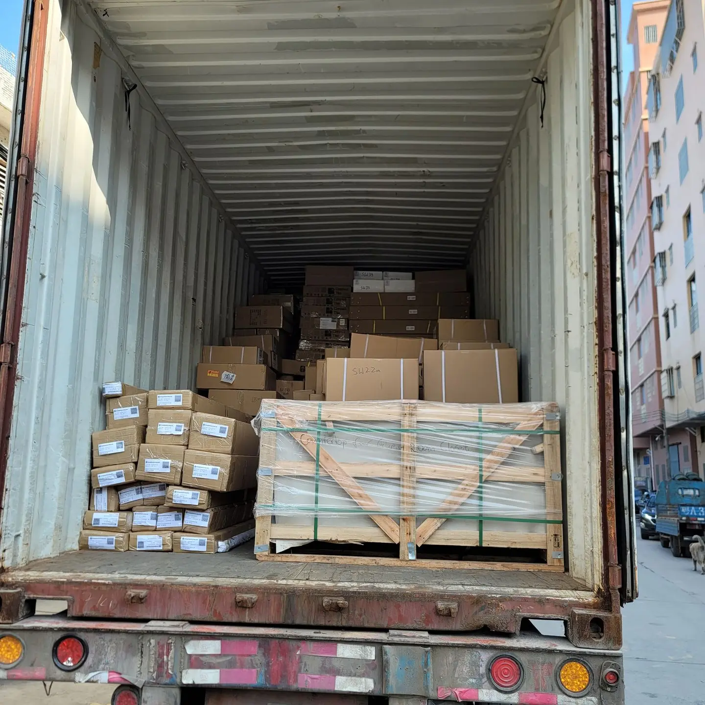  An image of a truck loaded with boxes and miscellaneous items.