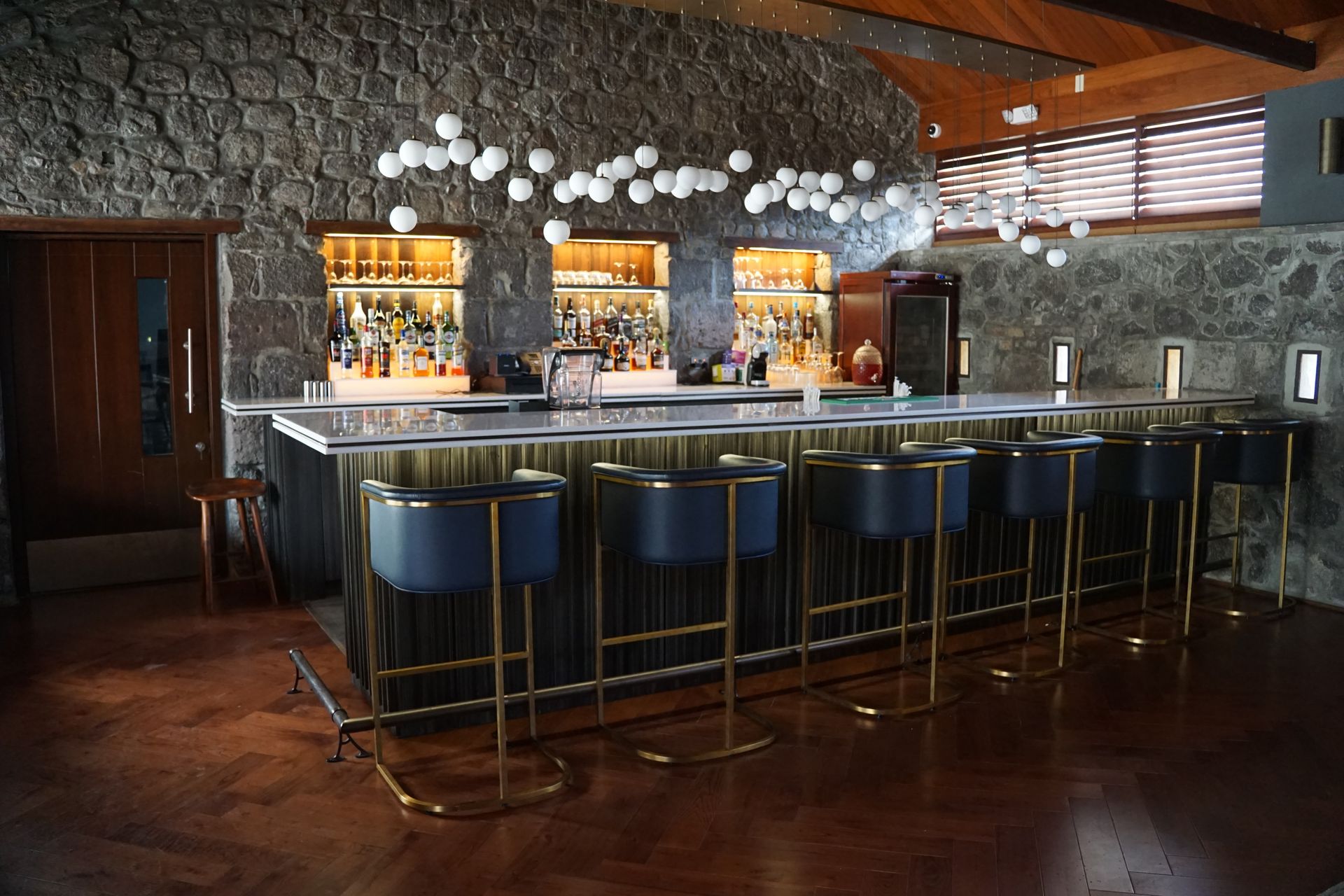 A hotel bar with 6 bat stools