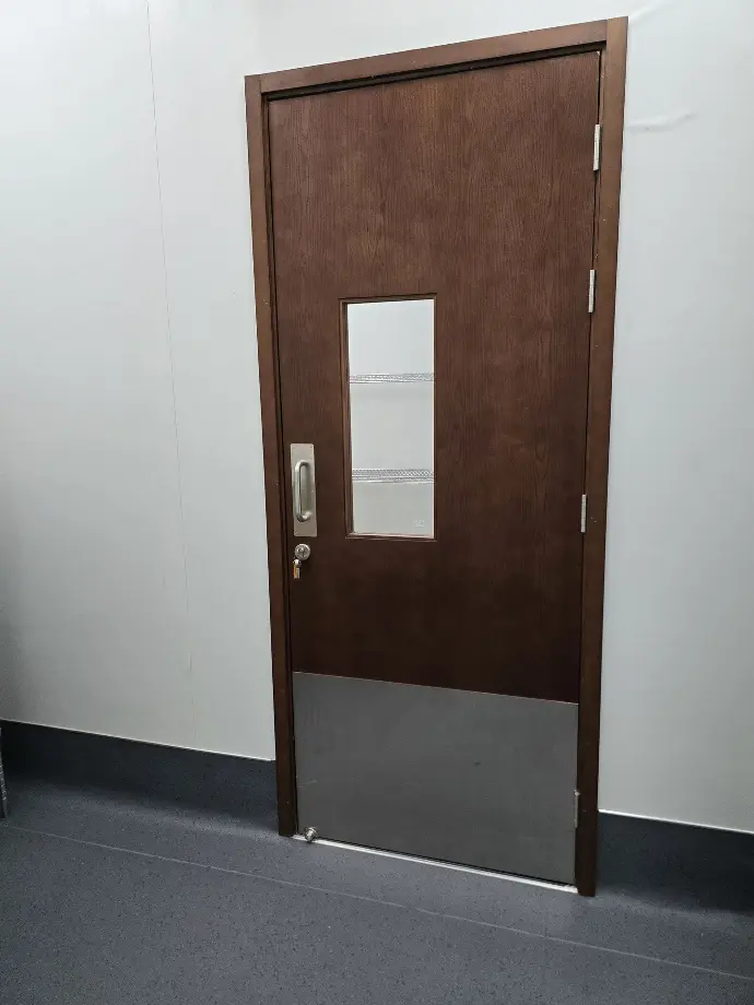 A heavy duty door, with a kick-plate