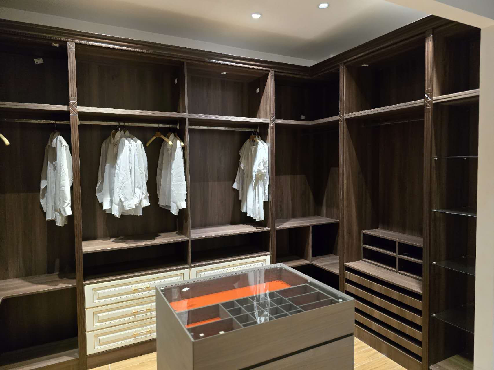 A walk-in closet with detailed millwork