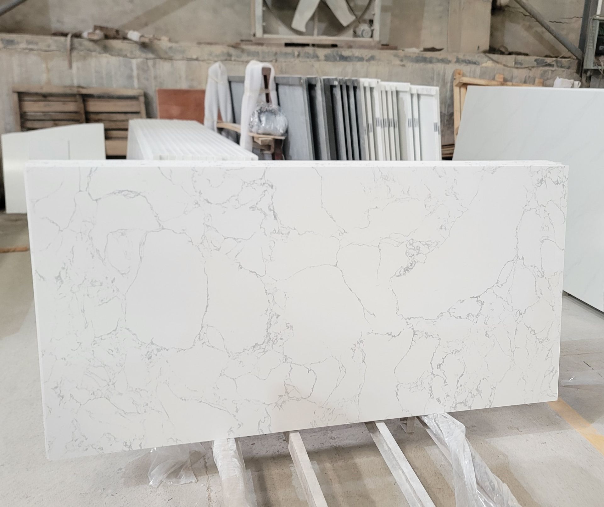 White quartz slab with subtle gray veining.